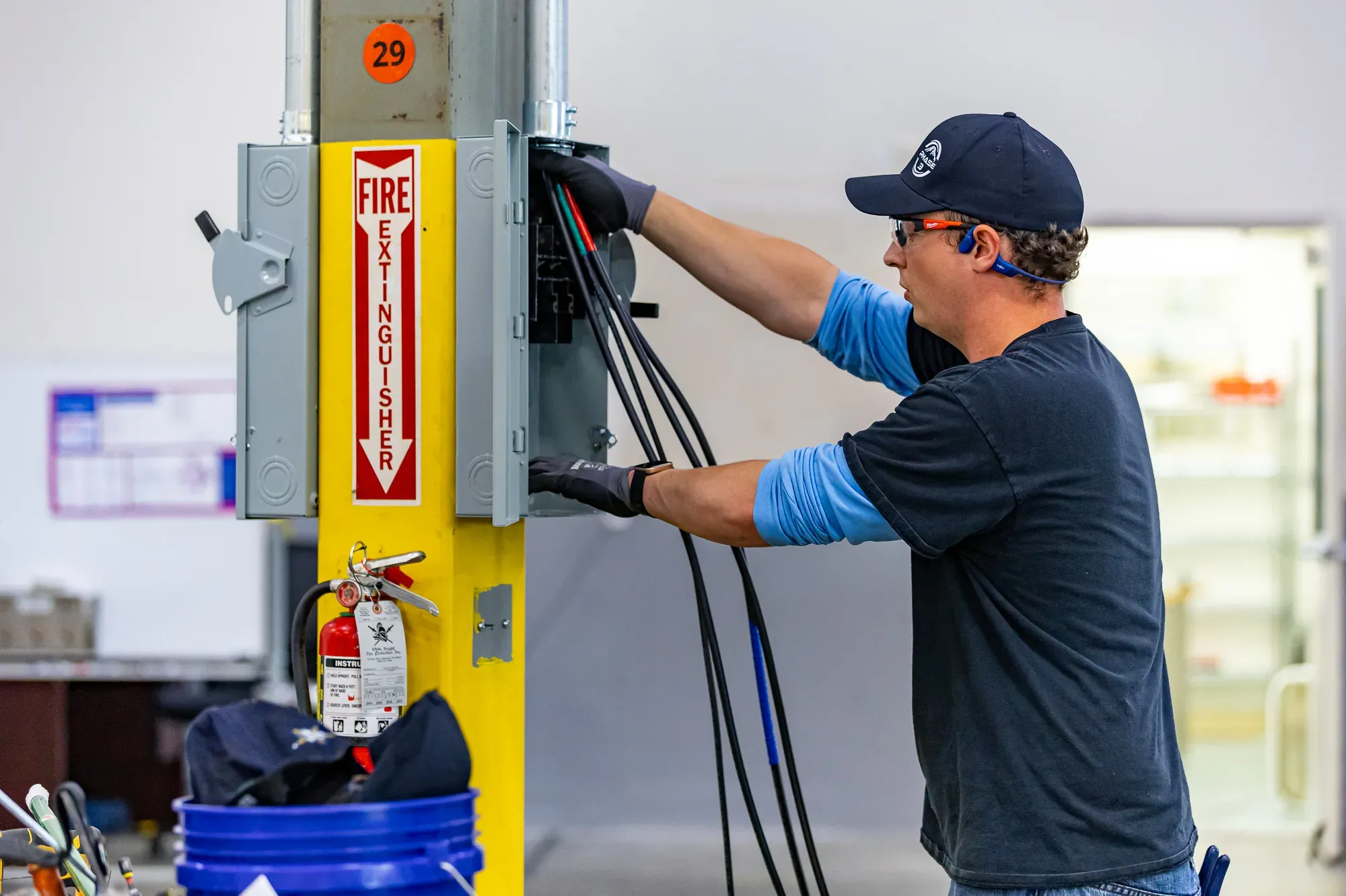 Electrician wiring a dedicated circuit at a residential property