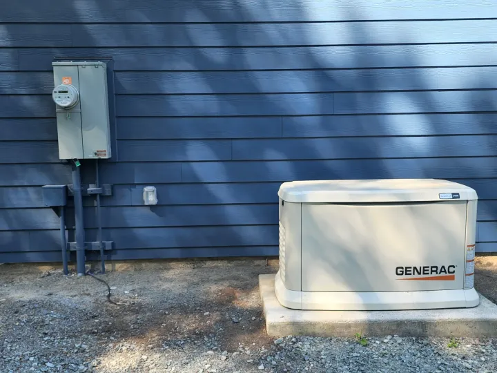 Standby whole-house generator installed on the side of a home in Snohomish County