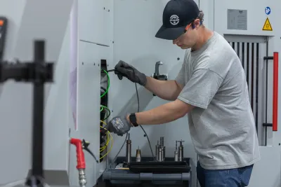 Industrial CNC machine electrical hookup and wiring in manufacturing facility, Snohomish County