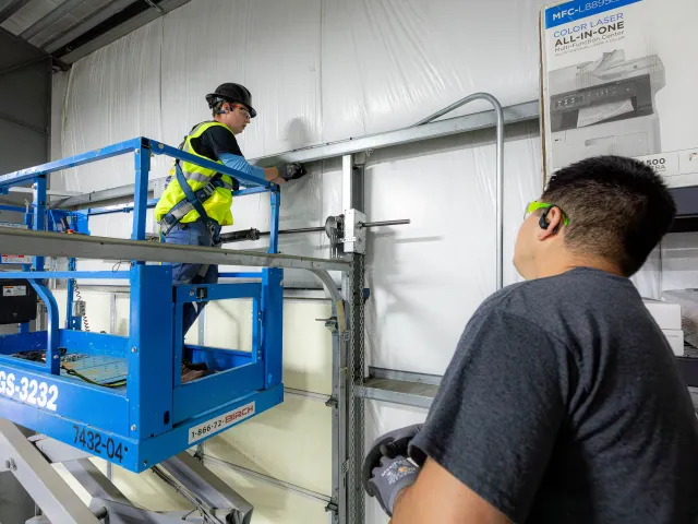 Complex industrial cable routing in manufacturing facility with conduit and cable tray systems
