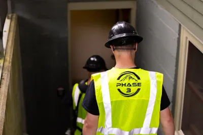 Phase 3 Electric crew arriving at a residential jobsite for electrical safety installation