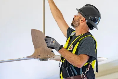 Phase 3 Electric licensed electrician installing a ceiling fan in a Monroe, WA home