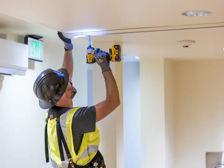 Phase 3 electrician performing electrical installation work