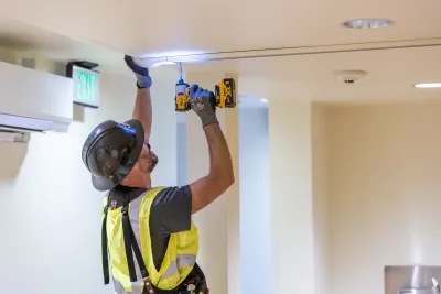 Phase 3 electrician performing electrical installation work