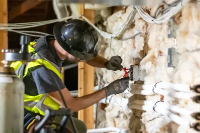 Phase 3 electrician working on residential wiring during home rewiring project