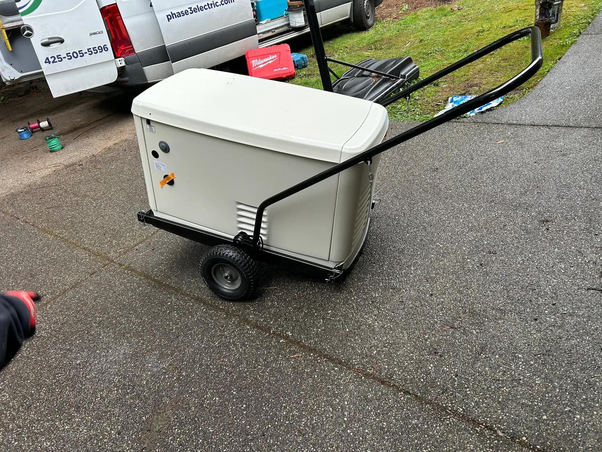 Portable generator on a wheeled cart at a construction jobsite